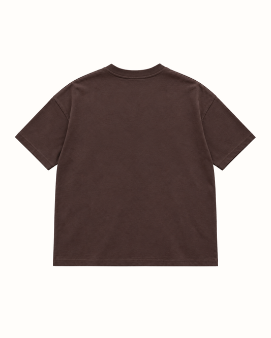 Plain back of the brown YTHEB appliqué T-shirt, showing the dropped shoulders and ribbed crew neck.