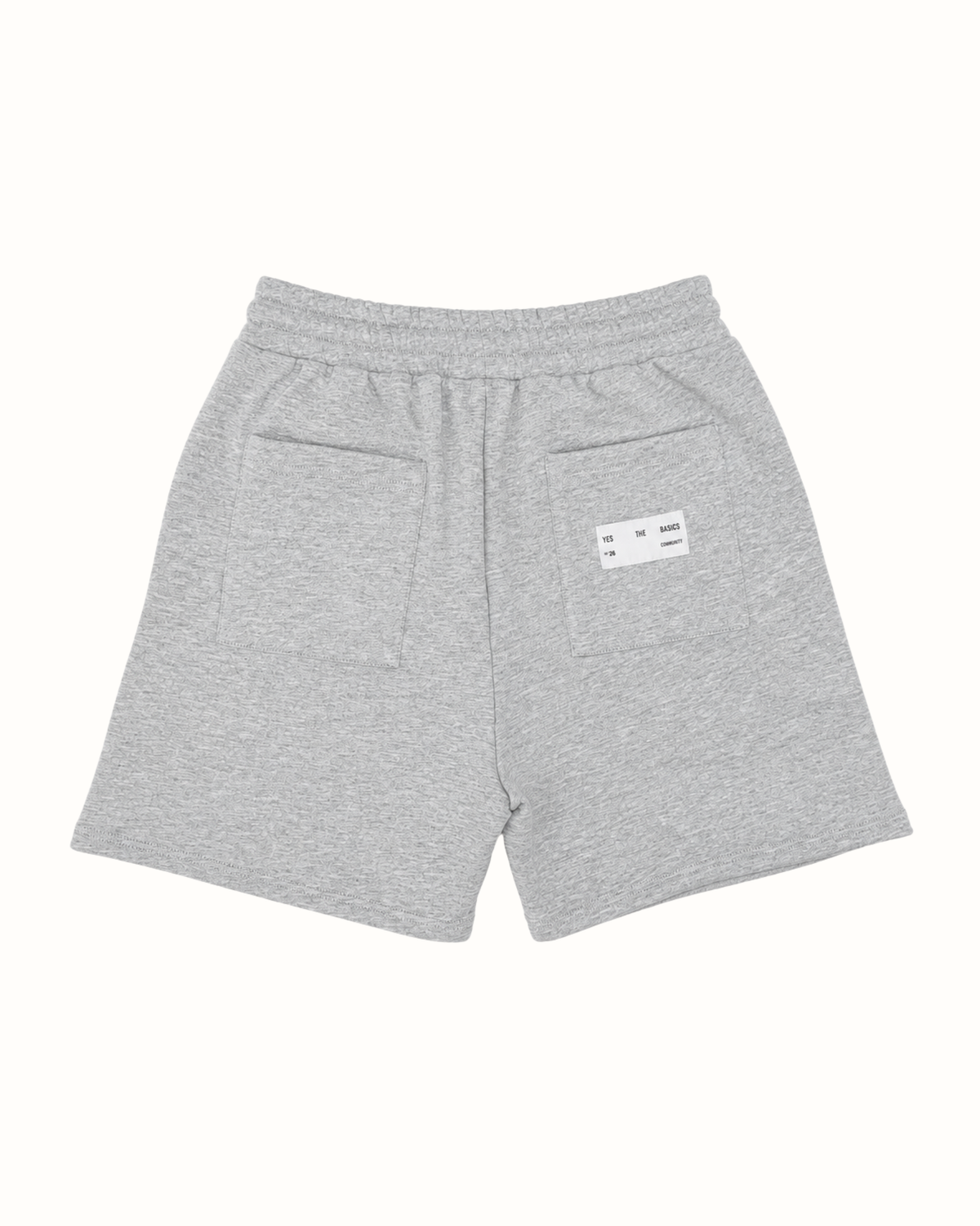 Light gray heathered sweat shorts with an elastic waistband, featuring a side pocket and a small white brand label on the back.