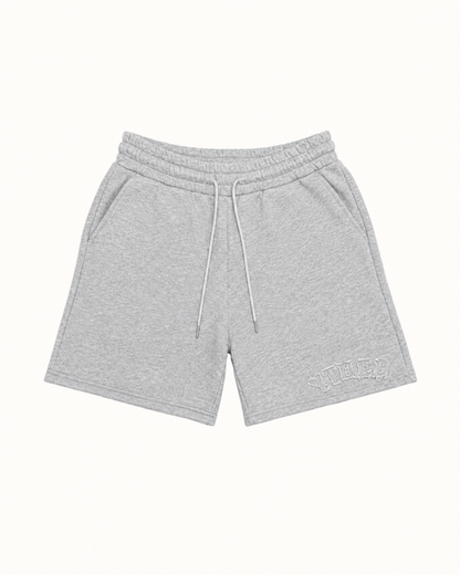 Light gray heathered sweat shorts with a white drawstring and a tonal embroidered logo on the lower left leg, displayed flat against a solid off-white background.