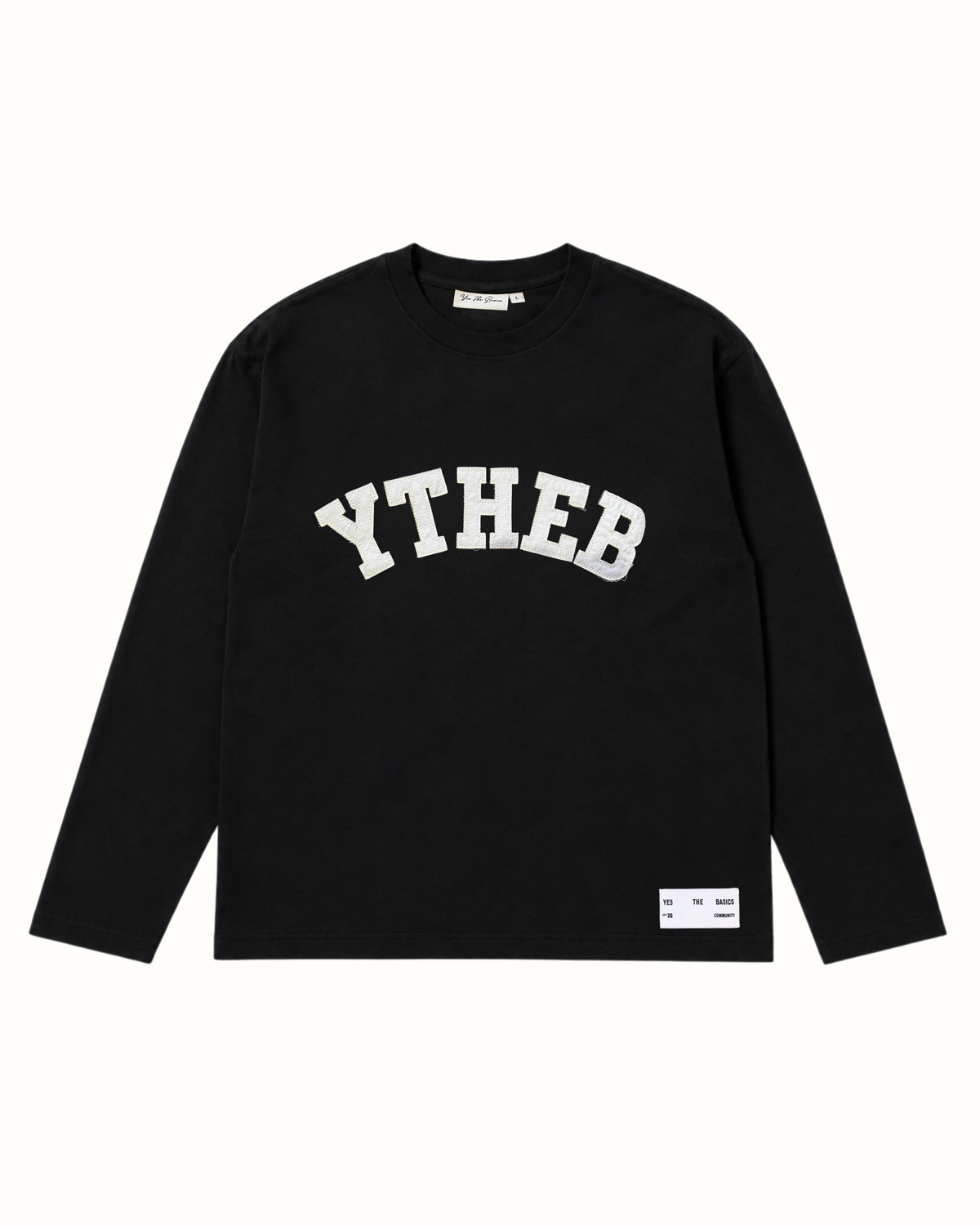 Black YTHEB long sleeve tee, front view, with white arc appliqué lettering designed to fray as it wears