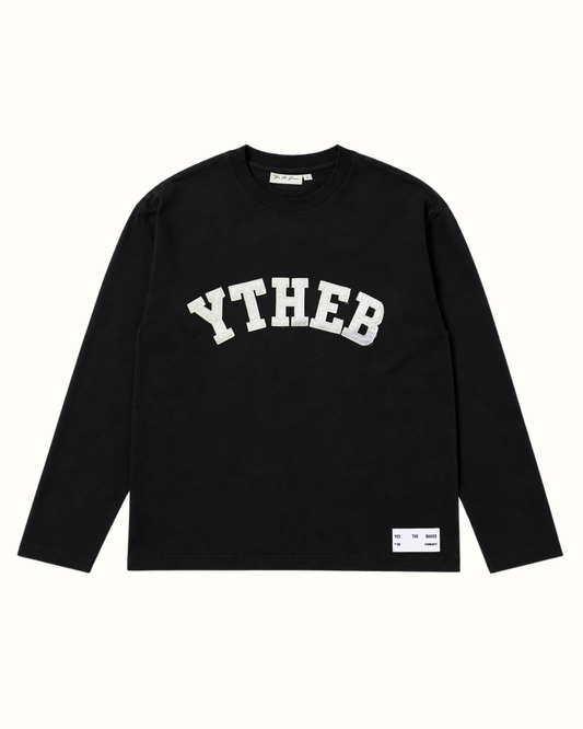Black YTHEB long sleeve tee, front view, with white arc appliqué lettering designed to fray as it wears